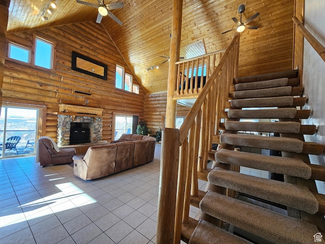 11905 E 24560 N, Fairview, UT 84629 - staircase with high vaulted ceiling, rustic walls, ceiling fan, wood ceiling, and tile patterned floors
