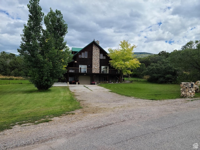 11905 E 24560 N, Fairview, UT 84629 - log home featuring a wooden deck, a garage, and a front lawn