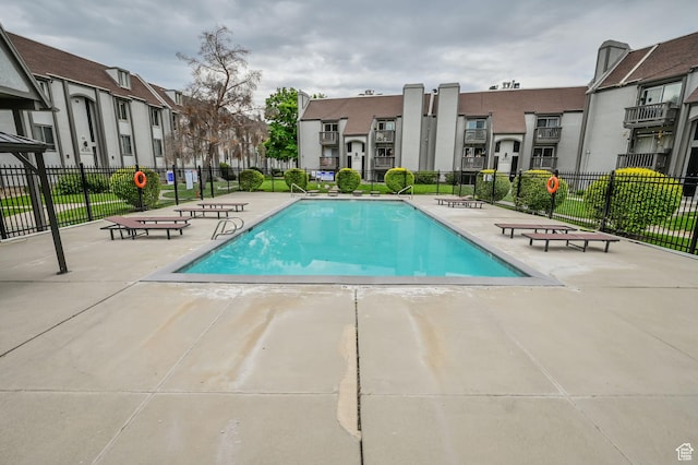 view of pool featuring a patio
