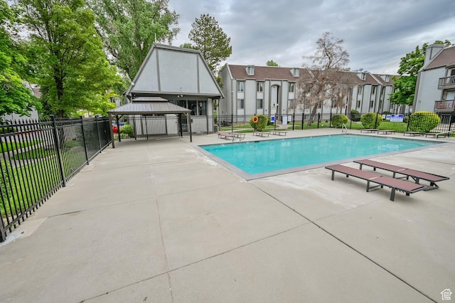 view of pool featuring a gazebo and a patio area
