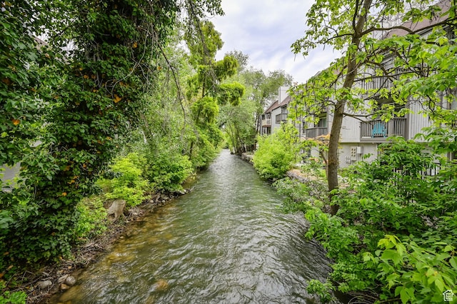 surrounding community featuring a water view
