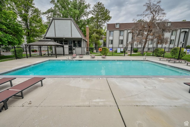 view of swimming pool featuring a gazebo and a patio area