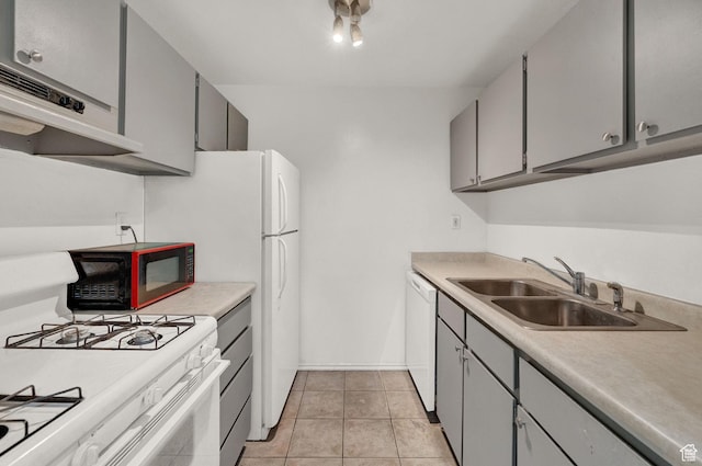 kitchen featuring gray cabinets, light tile patterned flooring, sink, and white appliances