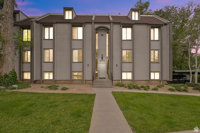 view of outdoor building at dusk