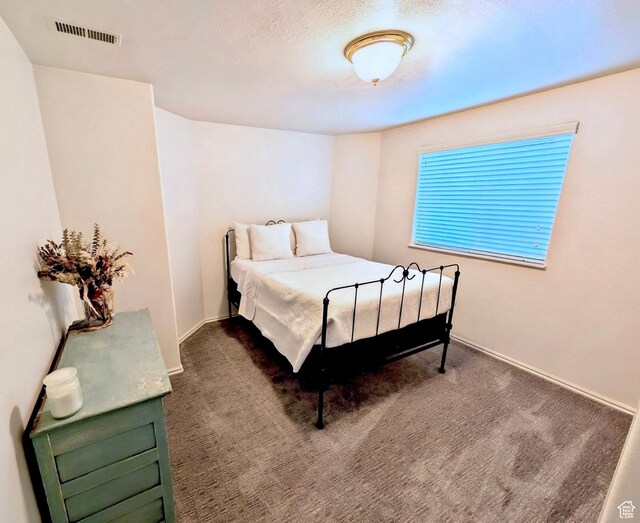 818 Summit Dr, Smithfield, UT 84335 - bedroom featuring dark colored carpet and baseboards