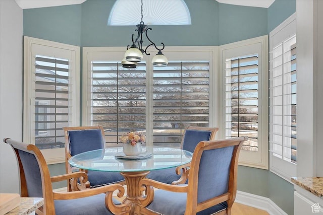 818 Summit Dr, Smithfield, UT 84335 - dining area featuring a chandelier, plenty of natural light, baseboards, and vaulted ceiling
