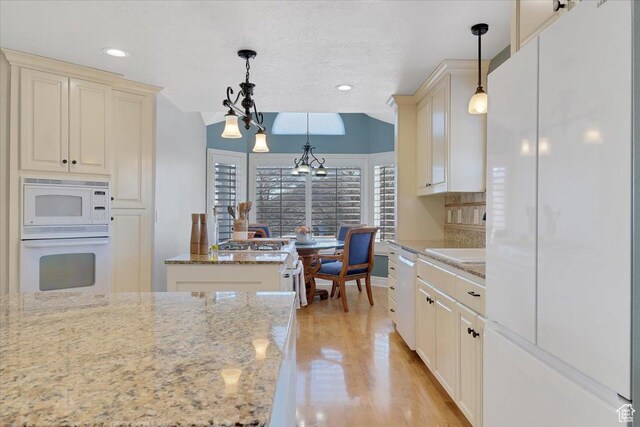 818 Summit Dr, Smithfield, UT 84335 - kitchen with white appliances, light wood-type flooring, light stone countertops, pendant lighting, and recessed lighting