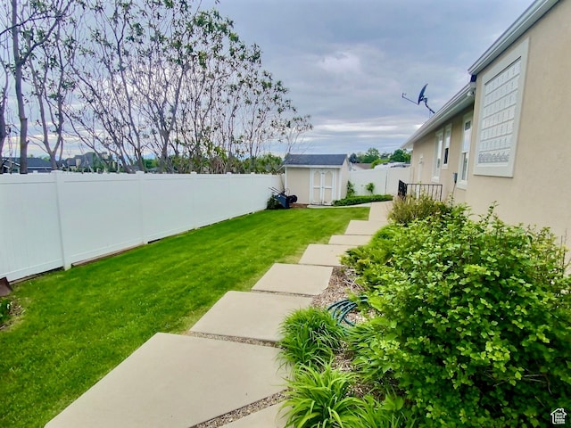 818 Summit Dr, Smithfield, UT 84335 - view of yard featuring a storage shed, an outbuilding, and a patio