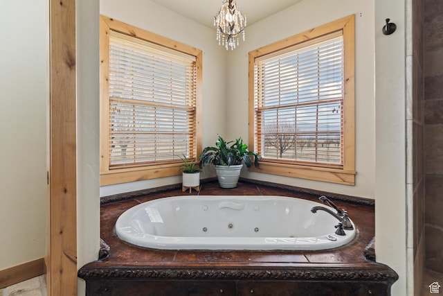 655 W 85 S, Glenwood, UT 84730 - bathroom featuring a jetted tub and a chandelier