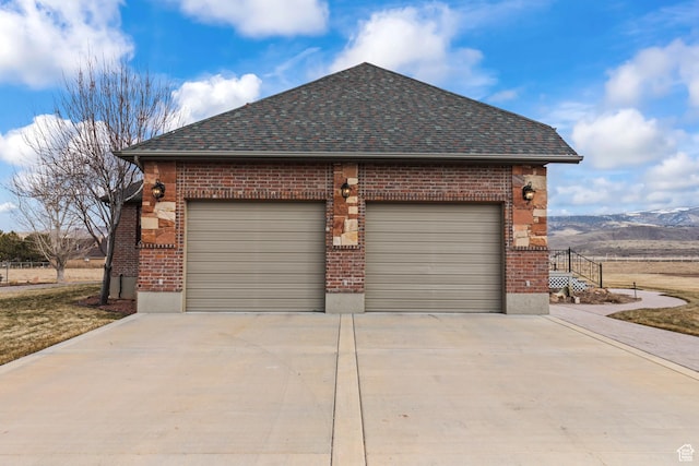 655 W 85 S, Glenwood, UT 84730 - view of side of home featuring brick siding, driveway, a garage, and roof with shingles