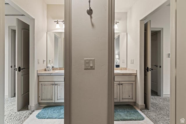 655 W 85 S, Glenwood, UT 84730 - bathroom featuring two vanities and tile patterned flooring