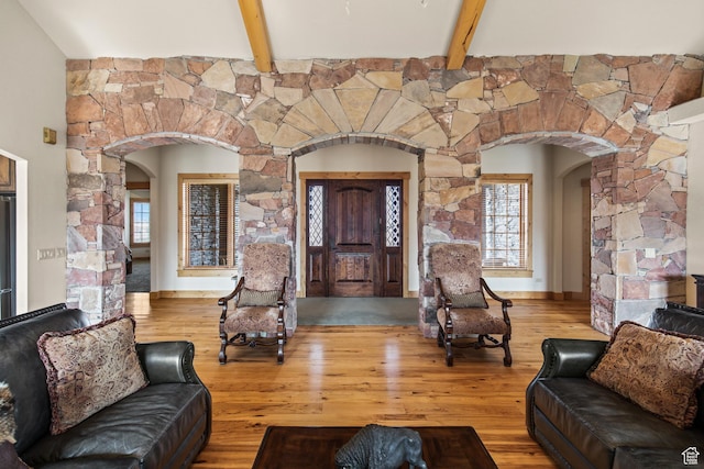 655 W 85 S, Glenwood, UT 84730 - living area featuring arched walkways, wood finished floors, and beam ceiling