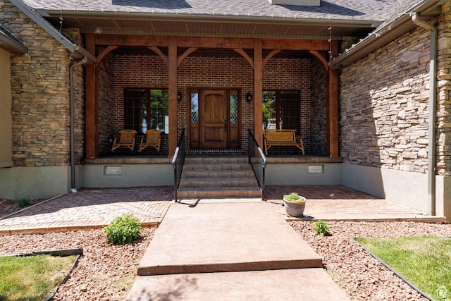 655 W 85 S, Glenwood, UT 84730 - doorway to property featuring covered porch, crawl space, and stone siding