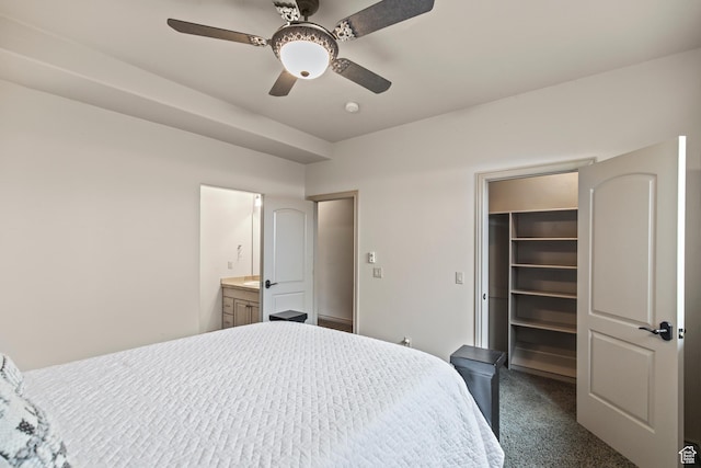655 W 85 S, Glenwood, UT 84730 - bedroom featuring dark colored carpet, a spacious closet, a closet, a ceiling fan, and connected bathroom