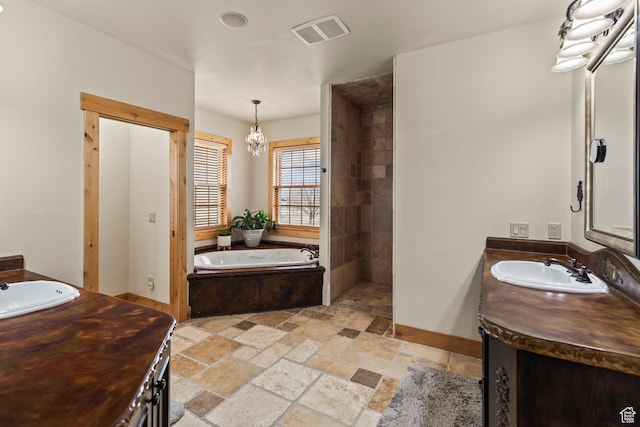 655 W 85 S, Glenwood, UT 84730 - full bathroom featuring vanity, stone tile floors, and a bath