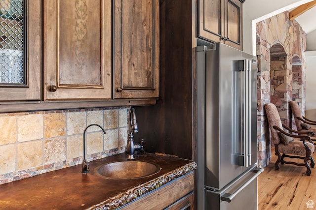 655 W 85 S, Glenwood, UT 84730 - kitchen with high quality fridge, dark countertops, dark brown cabinetry, and wood finished floors
