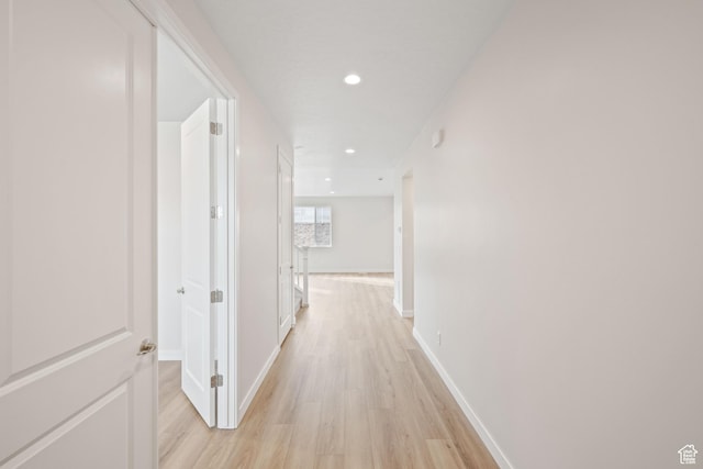 hall with light hardwood / wood-style floors
