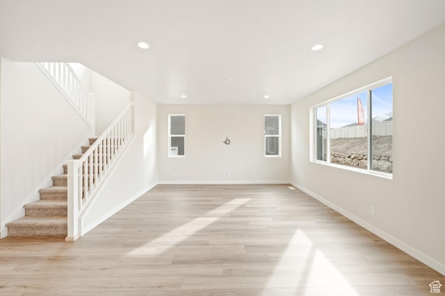 unfurnished living room featuring light hardwood / wood-style floors