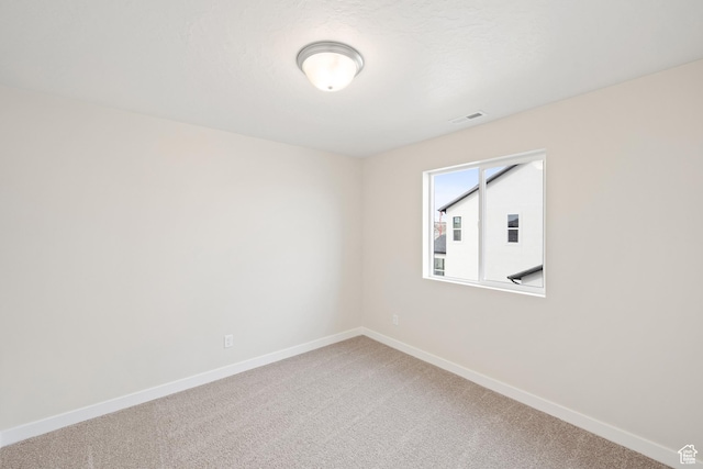 unfurnished room featuring carpet floors