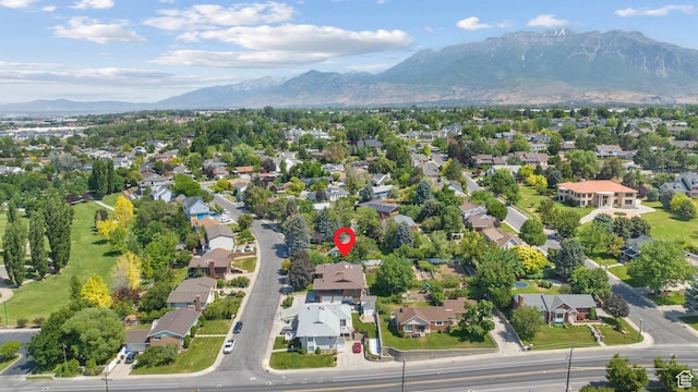 1975 Laguna Vista Dr, Orem, UT 84058 - aerial overview of property's location with a mountainous background and nearby suburban area