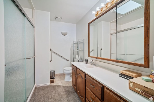 1975 Laguna Vista Dr, Orem, UT 84058 - bathroom featuring vanity, a shower with door, and toilet