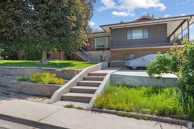 1975 Laguna Vista Dr, Orem, UT 84058 - view of front facade with stairs and brick siding