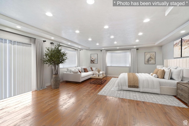 1975 Laguna Vista Dr, Orem, UT 84058 - bedroom with a raised ceiling, hardwood / wood-style floors, and multiple windows