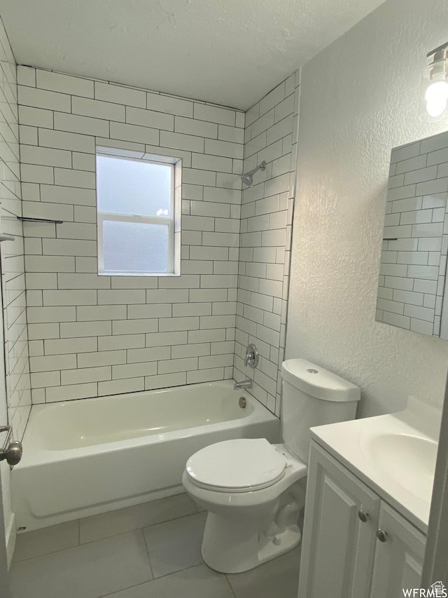 458 E Lambourne Ave, Salt Lake City, UT 84115 - full bathroom with tile patterned flooring, vanity, tiled shower / bath combo, toilet, and a textured ceiling