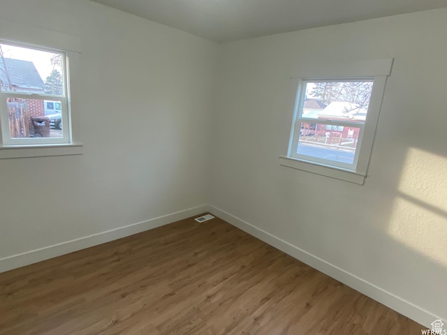 458 E Lambourne Ave, Salt Lake City, UT 84115 - spare room with hardwood / wood-style floors and a wealth of natural light