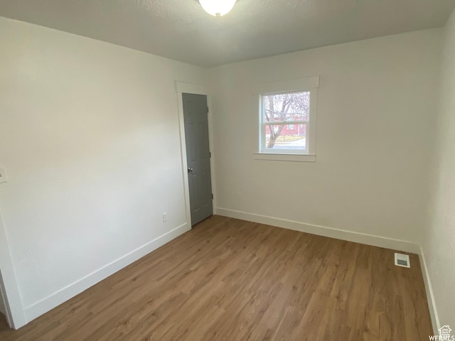 458 E Lambourne Ave, Salt Lake City, UT 84115 - spare room featuring wood-type flooring
