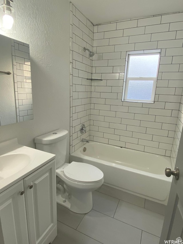 458 E Lambourne Ave, Salt Lake City, UT 84115 - full bathroom featuring tile patterned flooring, vanity, toilet, and tiled shower / bath