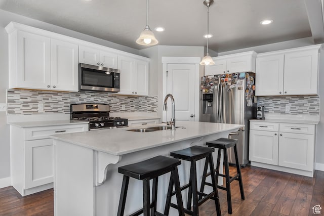 3937 W 1850 N, Lehi, UT 84043 - kitchen featuring white cabinets, dark hardwood / wood-style flooring, hanging light fixtures, a kitchen island with sink, and stainless steel appliances