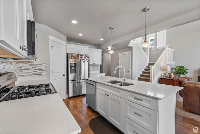 3937 W 1850 N, Lehi, UT 84043 - kitchen with pendant lighting, sink, a kitchen island with sink, backsplash, and stainless steel appliances