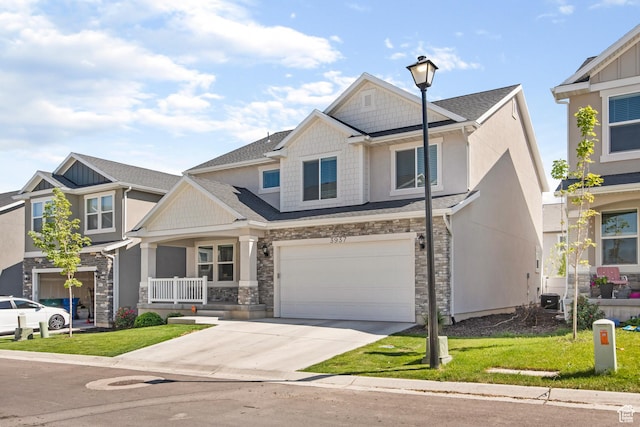 3937 W 1850 N, Lehi, UT 84043 - view of front of house with central AC, a garage, covered porch, and a front yard