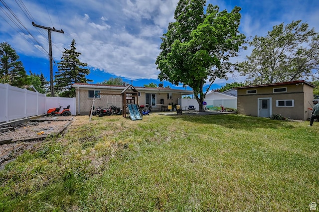 927 E 5650 S, Murray, UT 84121 - view of yard with a playground and an outbuilding
