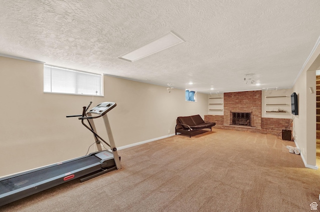 927 E 5650 S, Murray, UT 84121 - exercise area featuring built in shelves, a fireplace, a textured ceiling, and carpet flooring