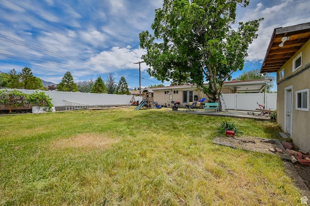 927 E 5650 S, Murray, UT 84121 - view of yard featuring a playground and a patio