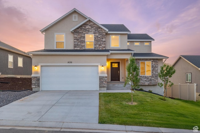 1636 W Onyx Dr Unit 217, Santaquin, UT 84655 - view of front of home featuring stone siding, stucco siding, an attached garage, and concrete driveway