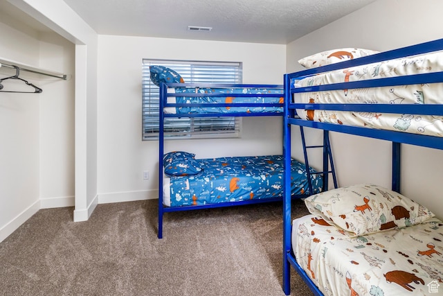 156 E Sailors Way Unit 11, Garden City, UT 84028 - carpeted bedroom with a textured ceiling