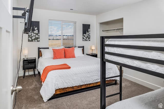 156 E Sailors Way Unit 11, Garden City, UT 84028 - bedroom featuring dark carpet and a closet