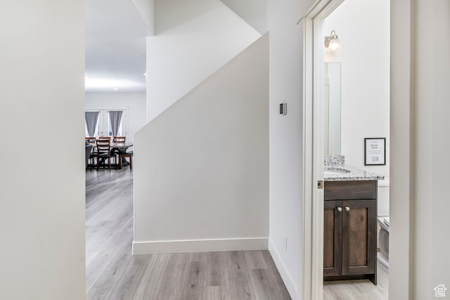 156 E Sailors Way Unit 11, Garden City, UT 84028 - hallway featuring sink and light hardwood / wood-style flooring