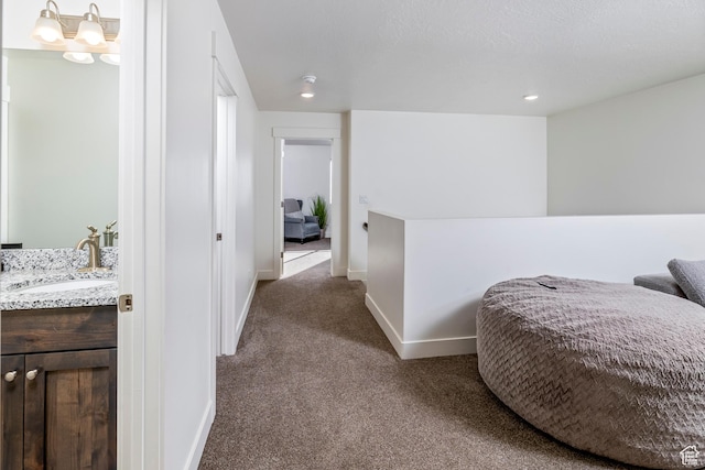156 E Sailors Way Unit 11, Garden City, UT 84028 - hallway with an inviting chandelier, carpet floors, and sink
