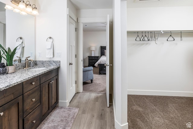156 E Sailors Way Unit 11, Garden City, UT 84028 - bathroom with vanity and wood-type flooring