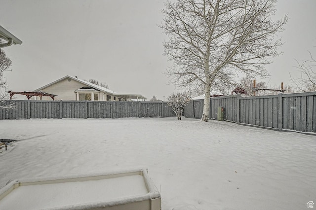 view of yard covered in snow