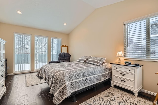 bedroom with lofted ceiling and hardwood / wood-style flooring