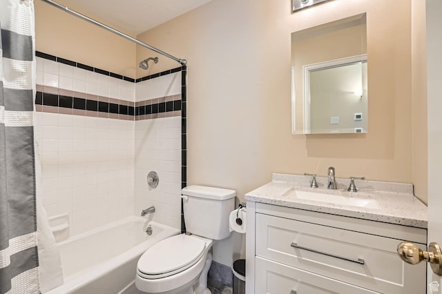 full bathroom featuring vanity, toilet, and shower / tub combo