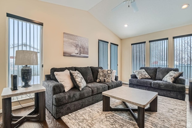 living room with wood-type flooring, lofted ceiling, and ceiling fan