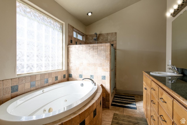 bathroom with tile patterned flooring, vanity, lofted ceiling, and shower with separate bathtub