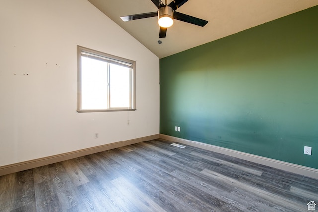 spare room with hardwood / wood-style flooring, lofted ceiling, and ceiling fan