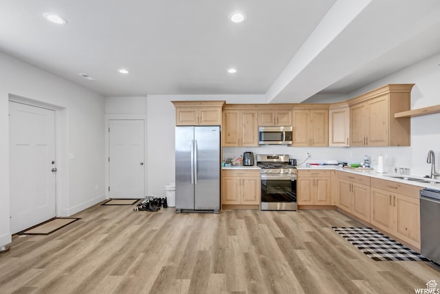 4024 W 2875 N, Plain City, UT 84404 - kitchen with appliances with stainless steel finishes, light brown cabinets, a sink, light wood-style flooring, and recessed lighting